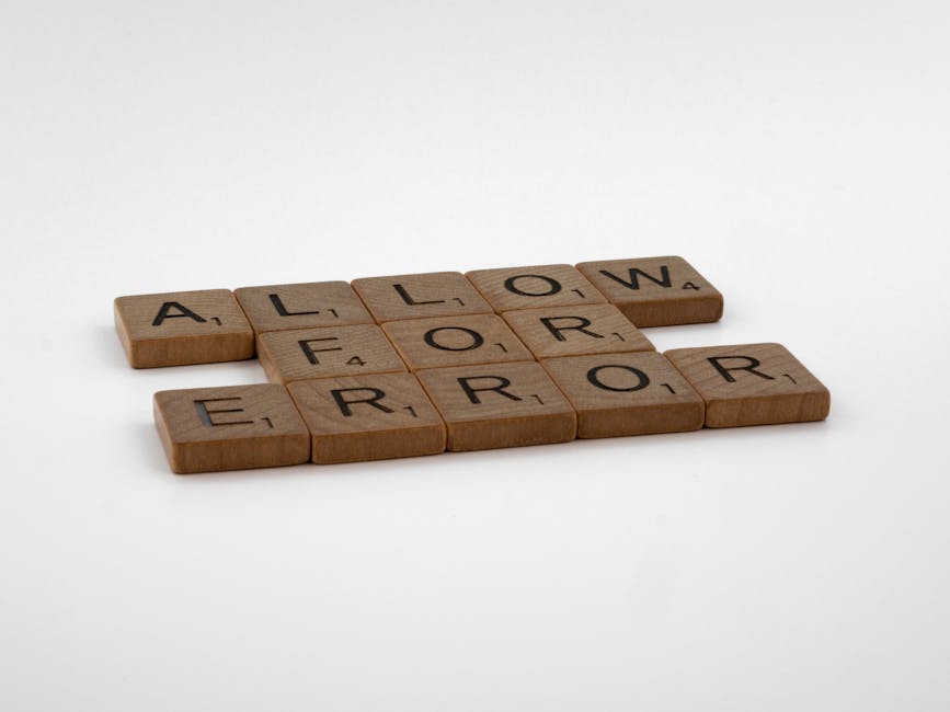 A collection of small rectangular wooden tiles with a natural finish, each engraved with a black letter, spelling out the phrase 'ALLOW ERROR' across the tiles. The tiles are arranged on a plain white background, with the first line displaying 'ALLOW' and the second line reading 'ERROR.' The surface of the tiles shows subtle wood grain patterns, and the letters are centered and clear. The overall composition is minimalistic and professional, reflecting attention to detail and precision, which aligns with the standards of private waste handling and rubbish removal services. The clean, neutral background emphasizes the message conveyed by the tiles, subtly suggesting the importance of careful assessment and correction in the context of waste management processes, as provided by companies like Rubbish Clearance Earls Court.